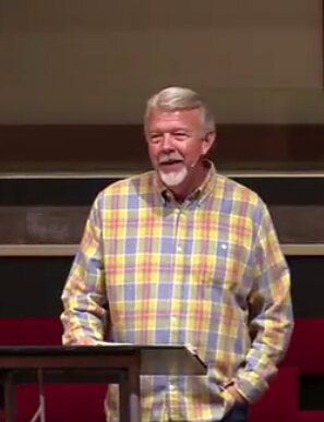 Pastor Doug Saunders preaching